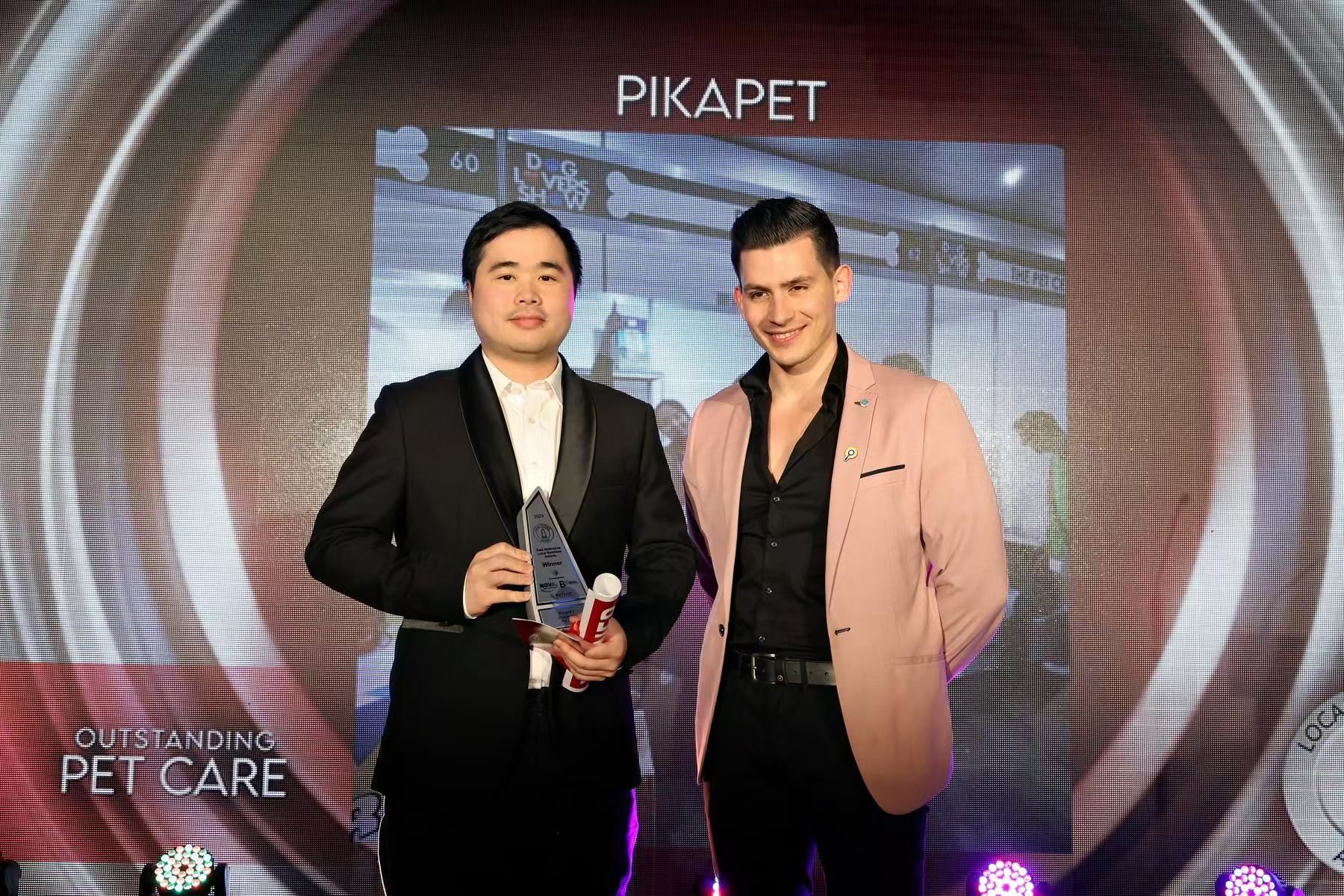 Lance holding the 2024 award on behalf of Pikapet at the East Melbourne Local Business Awards.